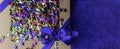 Craft gift box with satin blue bow and colorful stars Royalty Free Stock Photo