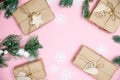 craft gifts with fir twigs on a pink background