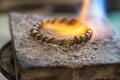 Craft jewelery making with flame torch Royalty Free Stock Photo