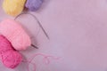 Craft knitting hobby background with skeins of soft pastel color wool yarn