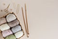 Craft knitting hobby background with yarn in natural colors