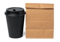 Craft paper bag with coffee cup on white background Royalty Free Stock Photo