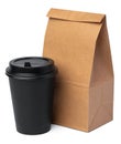 Craft paper bag with coffee cup on white background Royalty Free Stock Photo