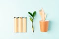 Craft paper coffee cup, pencil, green leaves sprout and recycled cutlery top view. Flat lay Zero waste, eco friendly, natural Royalty Free Stock Photo