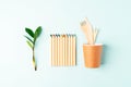 Craft paper coffee cup, pencil, green leaves sprout and recycled cutlery top view. Flat lay Zero waste, eco friendly, natural Royalty Free Stock Photo