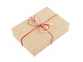 From craft paper, a gift tied with a red and white rope and a bow. Isolate on a white background Royalty Free Stock Photo