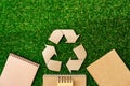 Craft paper on grass, recycling concept, top view