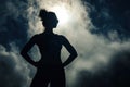 Craft a powerful image of a womans silhouette casting a strong shadow