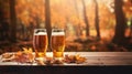 Craft pumpkin ale. Autumn beer in a glass on a wooden table and orange pumpkins Royalty Free Stock Photo