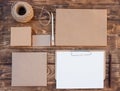 Craft set of empty different items, boxes for gift, envelops, card, sheet, rope on wooden background Royalty Free Stock Photo