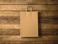 Craft shopping bag on the wooden background. In focus. Horizontal. 3d render