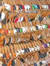 Craft store with many wooden shoes and colored leather