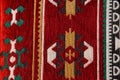 Craft texture of traditional Turkish ethnic patterned carpet closeup