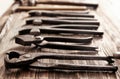Craft tools for work with leather on wooden table Royalty Free Stock Photo