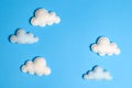 Craft white clouds in blue sky with frame, copyspace. Hand made felt toys. Abstract sky. Royalty Free Stock Photo