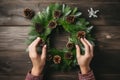 Crafted Christmas wreath master class. Woman showcases her festive decoration.