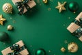 Top-down view capturing craft paper gift boxes, luxurious baubles, glittering star ornaments, jingle bell