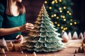 Crafting Christmas magic: woman\'s handcrafted tree