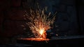 Crafting metal sparks during night work in a traditional blacksmith workshop in a rural setting Royalty Free Stock Photo