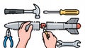 Crafting a missile with tools in a creative workshop setting Royalty Free Stock Photo