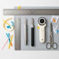 On a gray cutting mat include a metal ruler, two precision knives Royalty Free Stock Photo