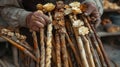 Crafting traditional Saint Joseph's staffs from natural materials as part of religious observance and decoration