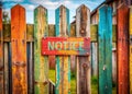 Crafting Visual Impact A Wooden Fence Sign Masterfully Composed Using the Rule of Thirds for Maximum Noticeability Royalty Free Stock Photo