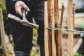 Craftman with a hammer, paling fence or picket fence Royalty Free Stock Photo