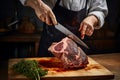 Craftsman adeptly cuts lamb shoulder, demonstrating mastery over meat preparation process