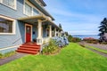 Craftsman American house in blue tones with wooden walkout porch Royalty Free Stock Photo