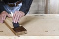 Craftsman brushing stain on American chestnut