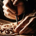 Craftsman carpenter carves ornate details in woodwork Royalty Free Stock Photo