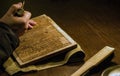 A craftsman carving a wooden printing block