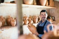 Craftsman with ceramic crockery Royalty Free Stock Photo