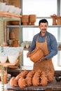 Craftsman with ceramic crockery Royalty Free Stock Photo