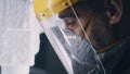 Craftsman controlling milling machine covered with plastic dust Royalty Free Stock Photo