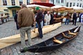 A craftsman demonstrates his boat making skills to tourists in Tallin, Estonia.