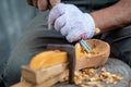 Craftsman demonstrates the process of making wooden spoons handmade using tools. Royalty Free Stock Photo