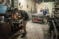 Craftsman with electric grinder tool on steel structure in factory Royalty Free Stock Photo