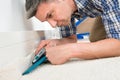 Craftsman Fitting Carpet Royalty Free Stock Photo