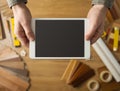 Craftsman holding a digital tablet Royalty Free Stock Photo