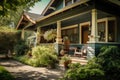 craftsman house with front porch and rocking chair, surrounded by lush greenery Royalty Free Stock Photo