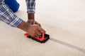 Craftsman Installing Carpet On Floor Royalty Free Stock Photo