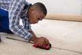 Craftsman Installing Carpet On Floor Royalty Free Stock Photo