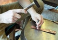 Craftsman makes copper bracelet Royalty Free Stock Photo