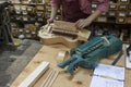 Craftsman makes a hurdy-gurdy wheel vielle in workshop. Royalty Free Stock Photo