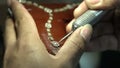 Craftsman making diamond necklace in craftman workshop. Jewelery master making