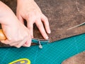 Craftsman marks pattern on the carved leather