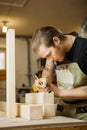 Craftsman measure wooden planks with ruler. Woodworker at workshop Royalty Free Stock Photo