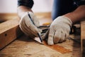 Craftsman measuring plank